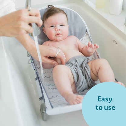 The First Years Sure Comfort Folding Baby Bather - Baby to Toddler Bath Tub - No-Slip Seat - for Sink or Tub Use