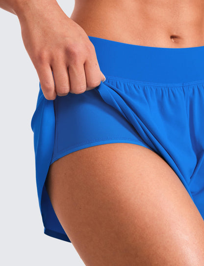 CRZ YOGA Mid Waisted Dolphin Athletic Shorts for Women 4" Lightweight High Split for Gym Workout with Liner Quick Dry Sparkle Blue Small